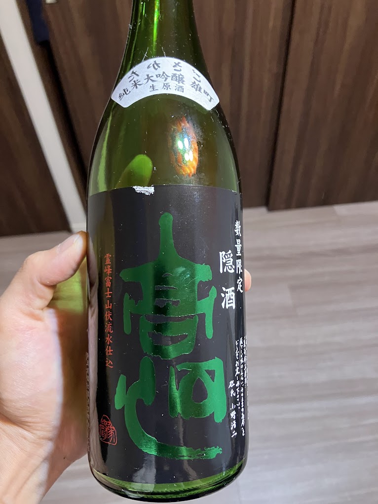 高砂 隠酒（純米大吟醸 雄町 生原酒）の表ラベル。黒地に緑の「高砂」の文字